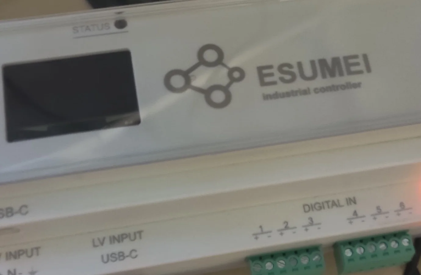 Front detail of the ESUMEI G3 industrial controller showing its display and terminals